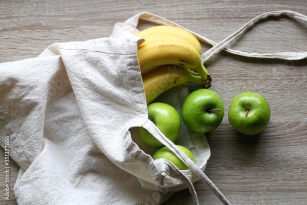 Fototapeta Canvas tote bag with apples and bananas. Top view.