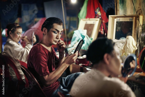 Fototapeta Opera performers applying make-up