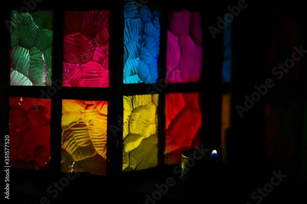 Fototapeta stained glass multi-colored glass of a beautiful lantern with a burning candle