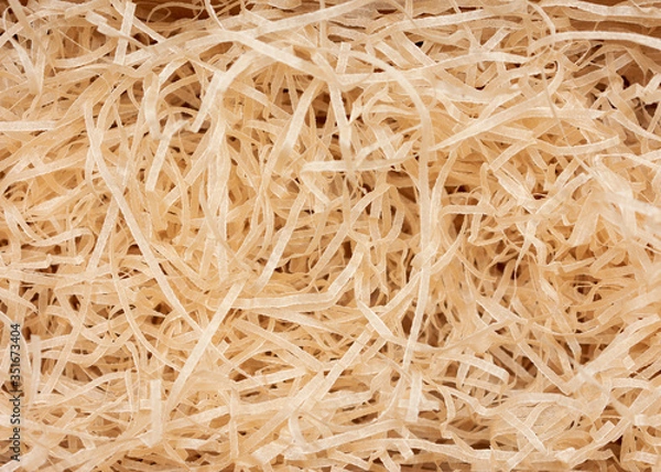 Fototapeta Box with decorative straw or shavings, texture, top view