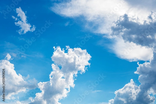 Obraz blue sky background with tiny clouds.