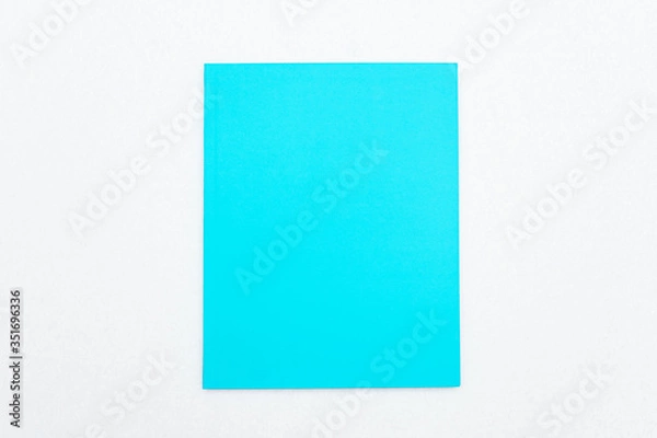 Fototapeta Blue notebook on white background, top view, copy space