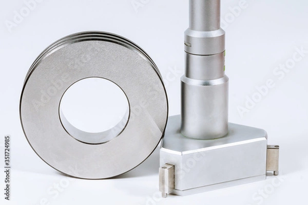 Fototapeta Mechanical Three-Point Internal Micrometer with Setting Ring on a white background.