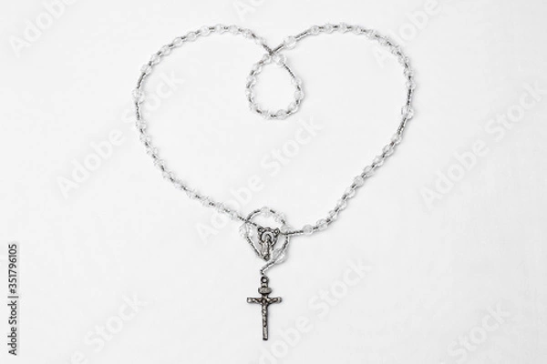 Fototapeta Catholic rosary with crucifix and medal of Virgin Mary on white background.