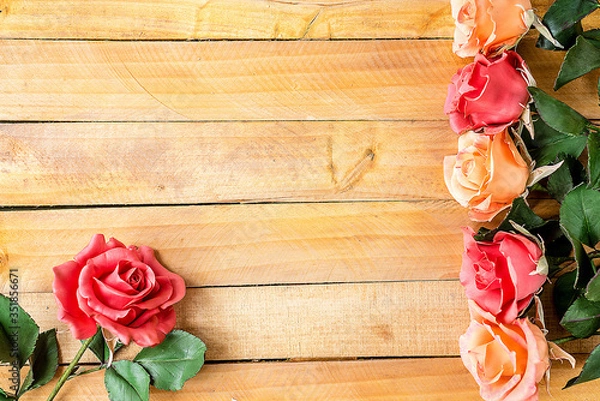 Fototapeta Handmade roses layout on wooden background. Background layout with free text space.