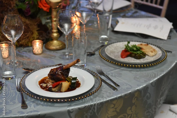 Fototapeta Rack of lambs served on a table