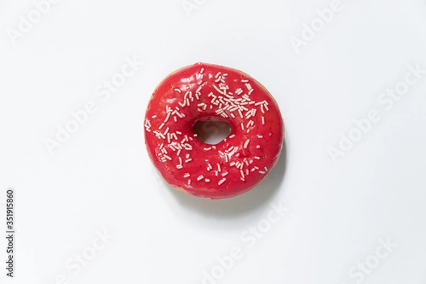 Fototapeta Appetizing sweet donut on a white background. Top view
