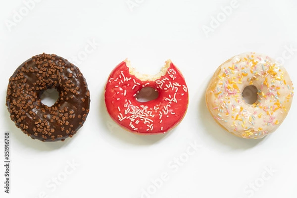 Fototapeta Appetizing sweet donut on a white background. Top view