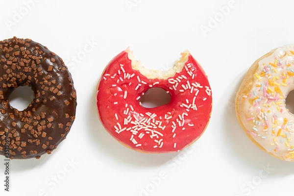 Fototapeta Appetizing sweet donut on a white background. Top view