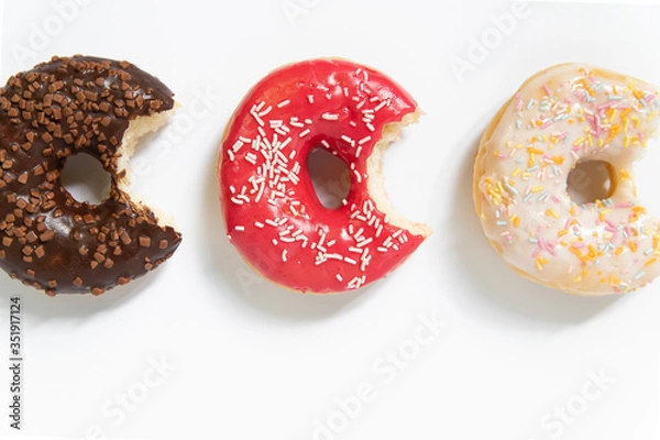 Fototapeta Appetizing sweet donut on a white background. Top view
