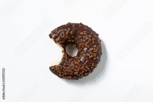 Fototapeta Appetizing sweet donut on a white background. Top view