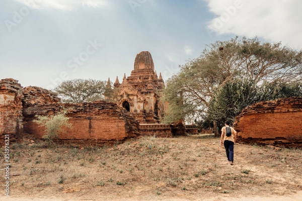 Fototapeta Tourist walks around the ruins of a temple in Bagan, Myanmar