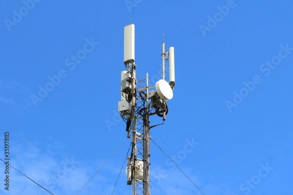 Fototapeta Base station mobile network antenna on a steel structure mast with a repeater. 3g, 4g, 5g.