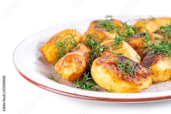 Fototapeta Fried fresh potatos and dill on a plate isolated on a white background