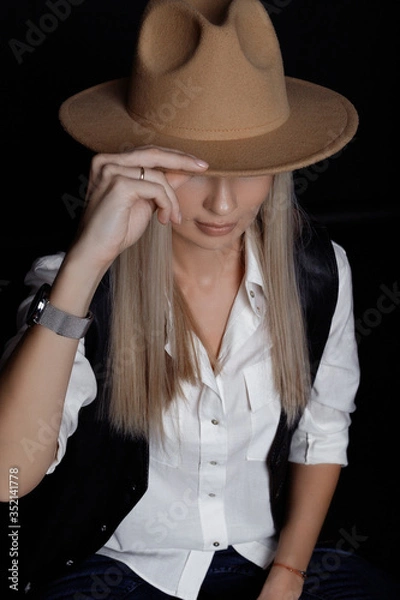 Obraz Girl covered her face with a hat.