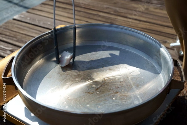Fototapeta Dissolve the beef tallow and prepare for cooking