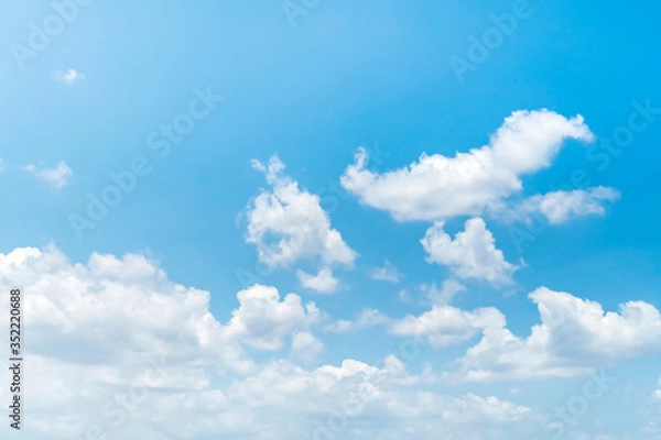 Obraz Blue sky background with clouds.