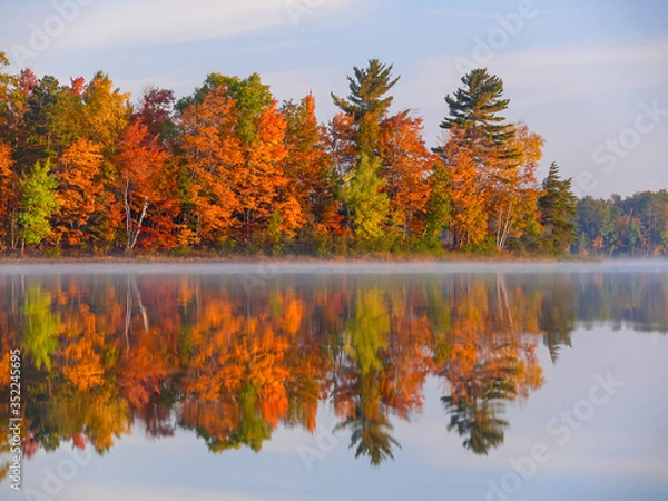 Obraz Reflection of colorful fall foliage on lake