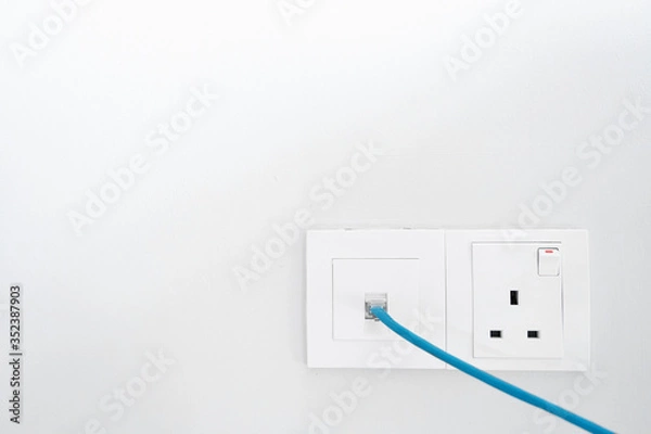 Fototapeta Power socket and Internet socket. Socket Malaysian type. Socket with switch on a white wall.