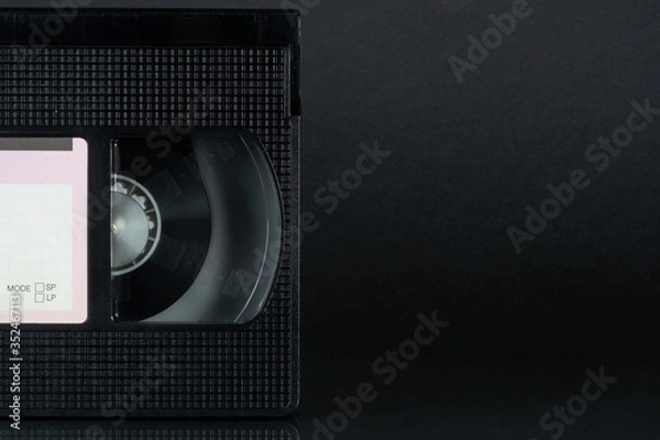 Obraz Video cassette VHS on the black background.
