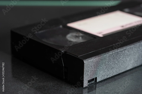 Obraz Video cassette VHS on the black background.