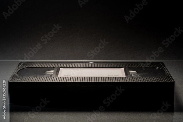 Obraz Video cassette VHS on the black background.