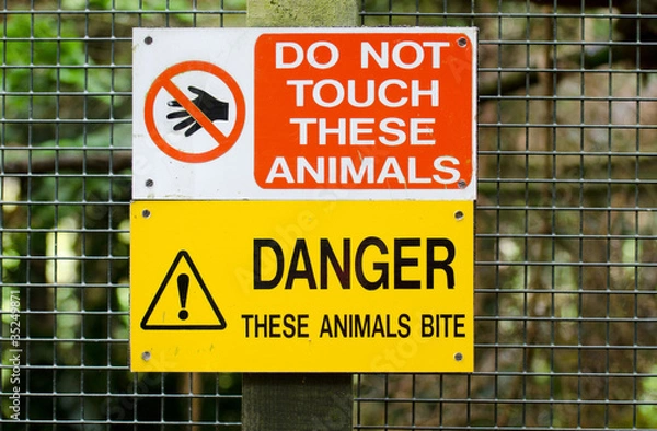 Obraz warning sign regarding animlas on fence