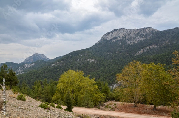 Fototapeta Slopes of the high Taurus mountains with clouds in Turkey in cloudy weather. Travel destination. Trekking and sport. 