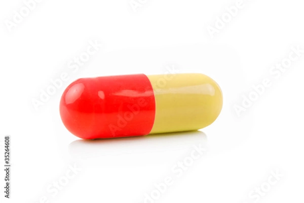 Fototapeta Medical pill against white background