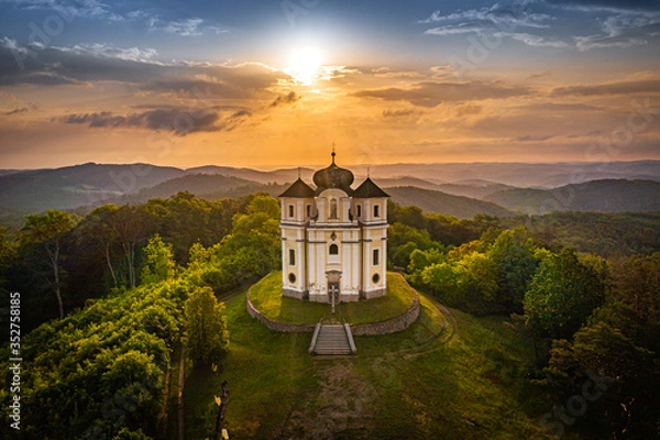Fototapeta Poppy Mountain is a peak in the Benesov Hills and an important place of pilgrimage. Baroque church of St. John the Baptist and the Virgin Mary of Carmel was built between 1719 and 1722.