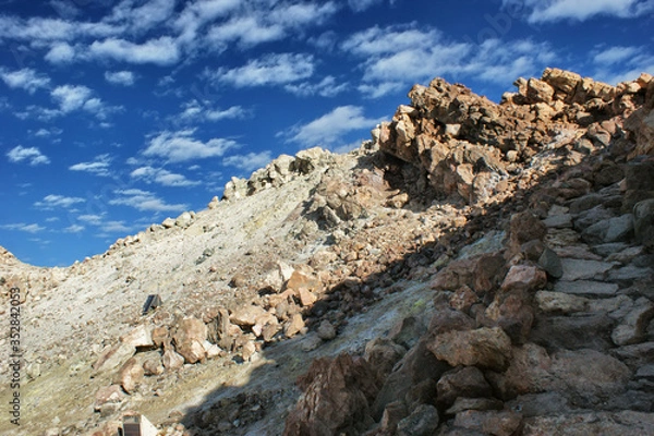 Fototapeta The way to the top of the Teide volcano. Stone path in the mountains to the top.