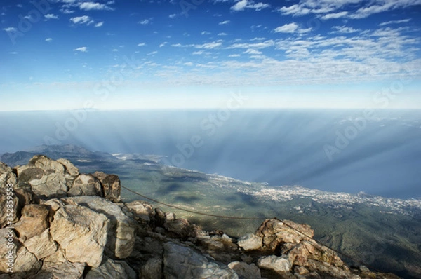 Fototapeta View from the top of a volcano Teide to the island of Tenerife. Cloud shadows are visible on the ground.
