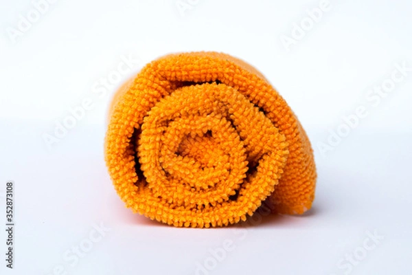 Obraz roll orange towel placed on white background