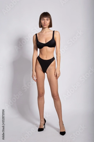 Fototapeta model snaps front in black underwear isolated on white