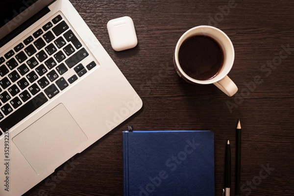 Obraz Notebook, pen, pencil and notebook on the table. Remote work.