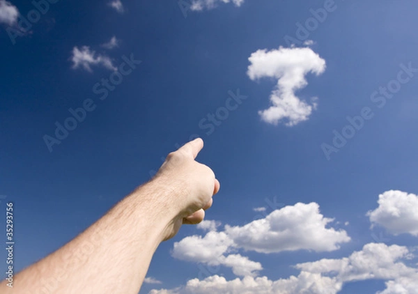 Fototapeta hand pointing at cloudy sky
