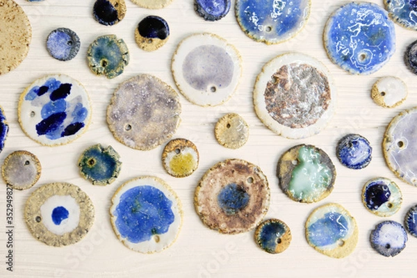 Obraz Modern pottery. Decorative ceramic, clay plate. Handmade light pottery.  Set of ceramic, bowls, cup with background.