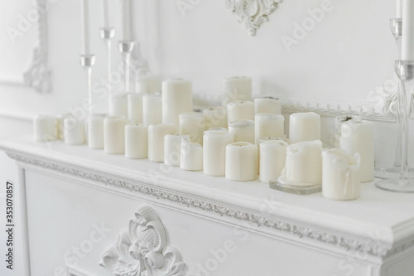 Obraz White candles on decorated mantelshelf