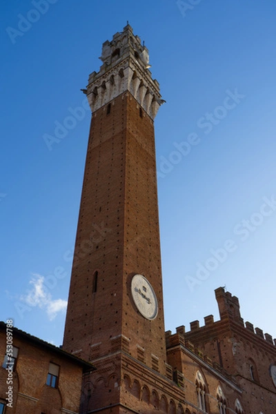 Fototapeta View of the Tower of Mangia in " Piazza del Campo" (Square of Campo) in Siena, Tuscany, Italy