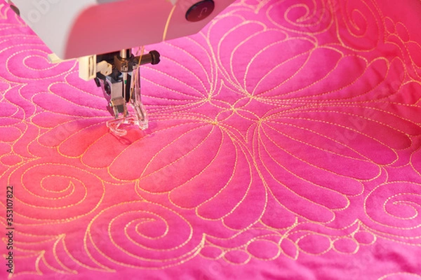 Fototapeta Process quilting with an electric sewing machine by using a free-motion technique