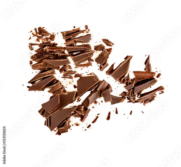 Fototapeta Chocolate broken pieces and shavings isolated on white background. Chunks of dark chocolate falling, top view