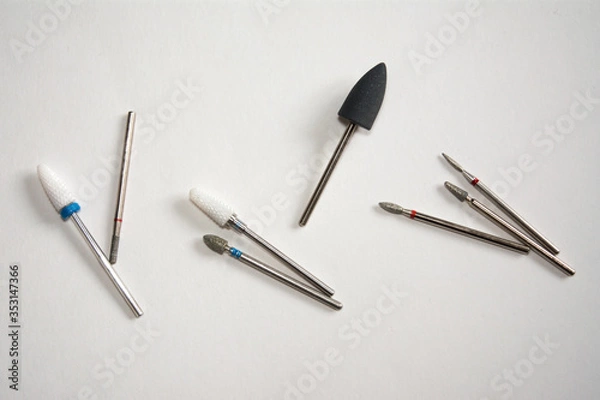 Fototapeta metal drill bit ceramic cutter for manicure machine master saws nails and gel Polish isolate on a white background place for text