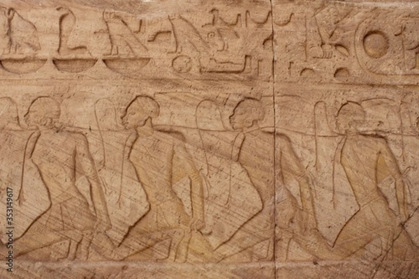 Fototapeta Wall carving showing war prisoners in Abou simbel temple in Aswan