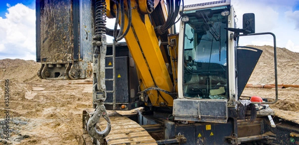 Fototapeta Hydraulic Drilling Rig. The device of bored piles with casing. Foundations and grounds. Drilling in the ground. Technologies.