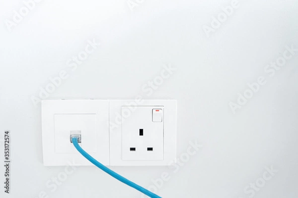 Fototapeta Power socket and Internet socket. Socket Malaysian type. Socket with switch on a white wall.