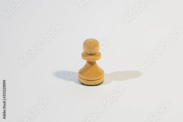 Obraz Chess pawn on the white background. 