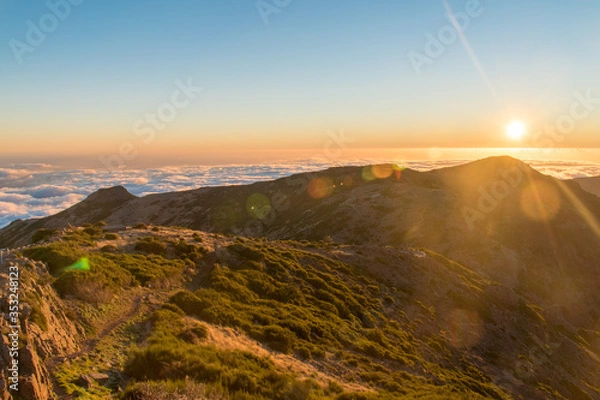 Fototapeta HDR of Sunset over the horizon filled with clouds hanging over the sea at Madeira