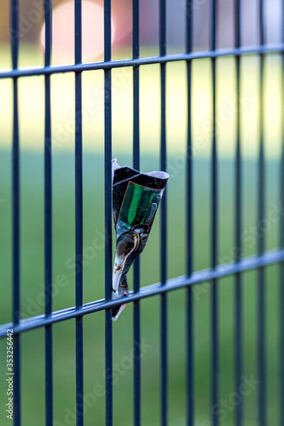 Obraz Piece of paper stuck on a fence diminishing perspective
