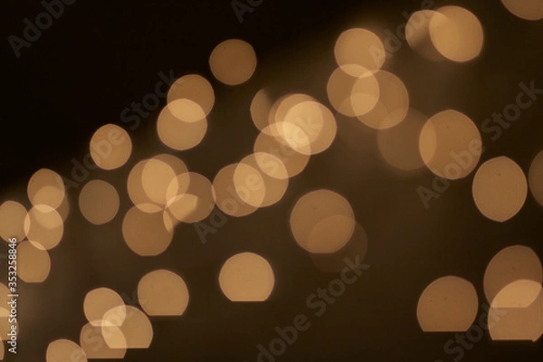Obraz Bokeh warm lights against black background