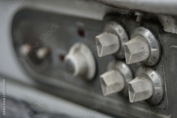Obraz Old stove focused on the knobs